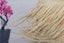 Fringed straw lampshade